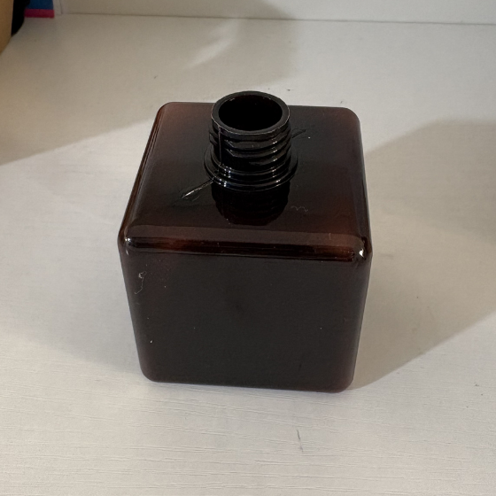 Empty reusable brown liquid dispenser bottle
