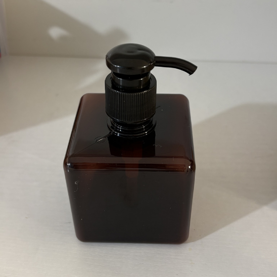 Empty reusable brown liquid dispenser bottle