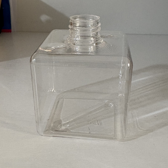 Empty reusable clear liquid dispenser bottle.